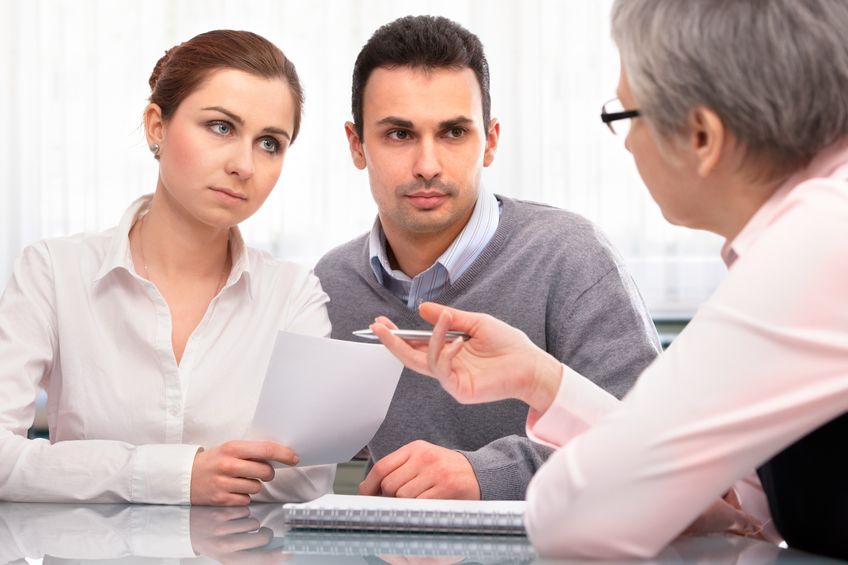 Young couple with solicitor