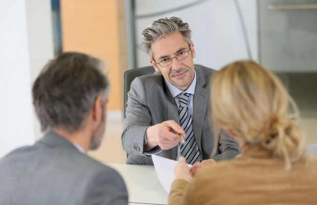 Couple in front of a solicitor