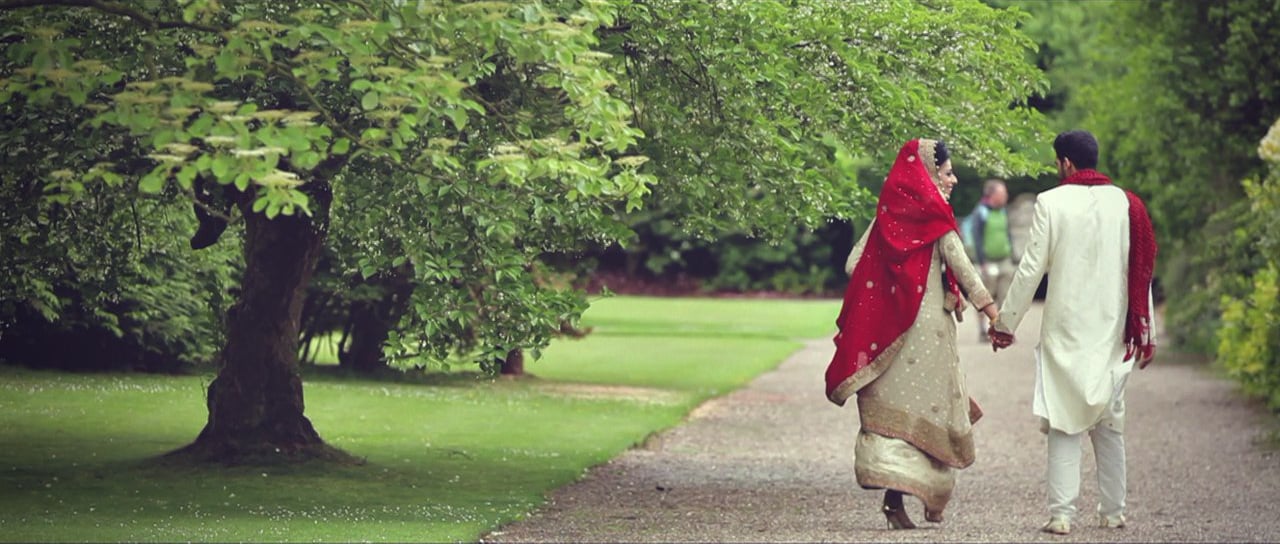 Muslim couple walking in park