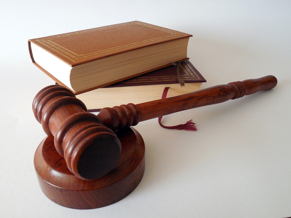 Wooden gavel and legal books