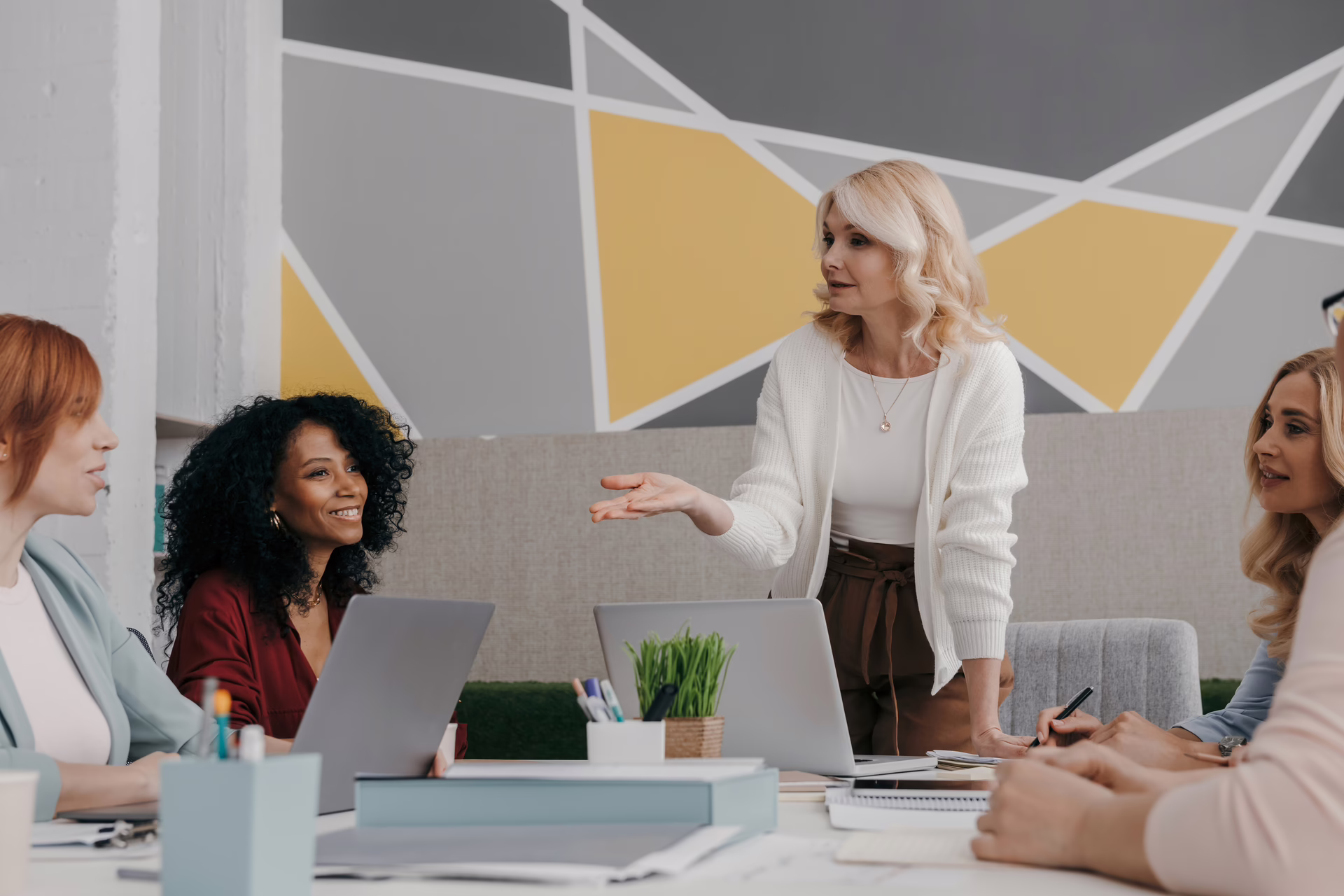 Professional women in a workplace team meeting