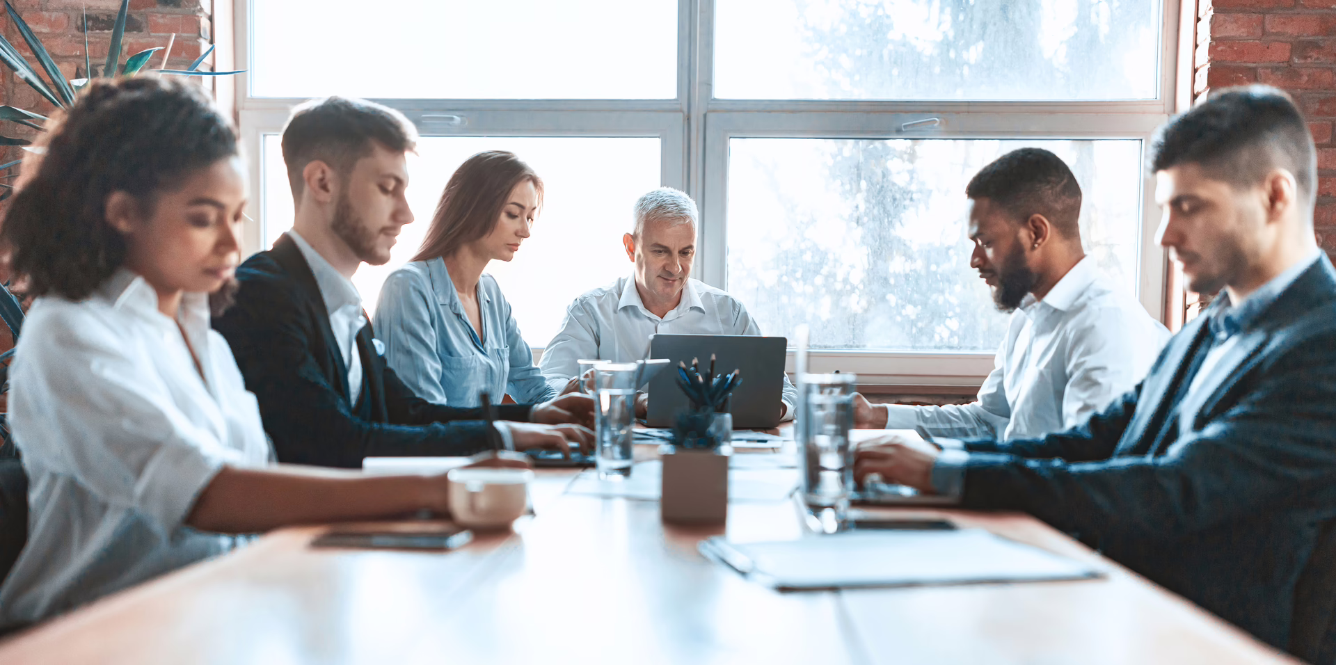 Group of professionals of different ages in a business meeting