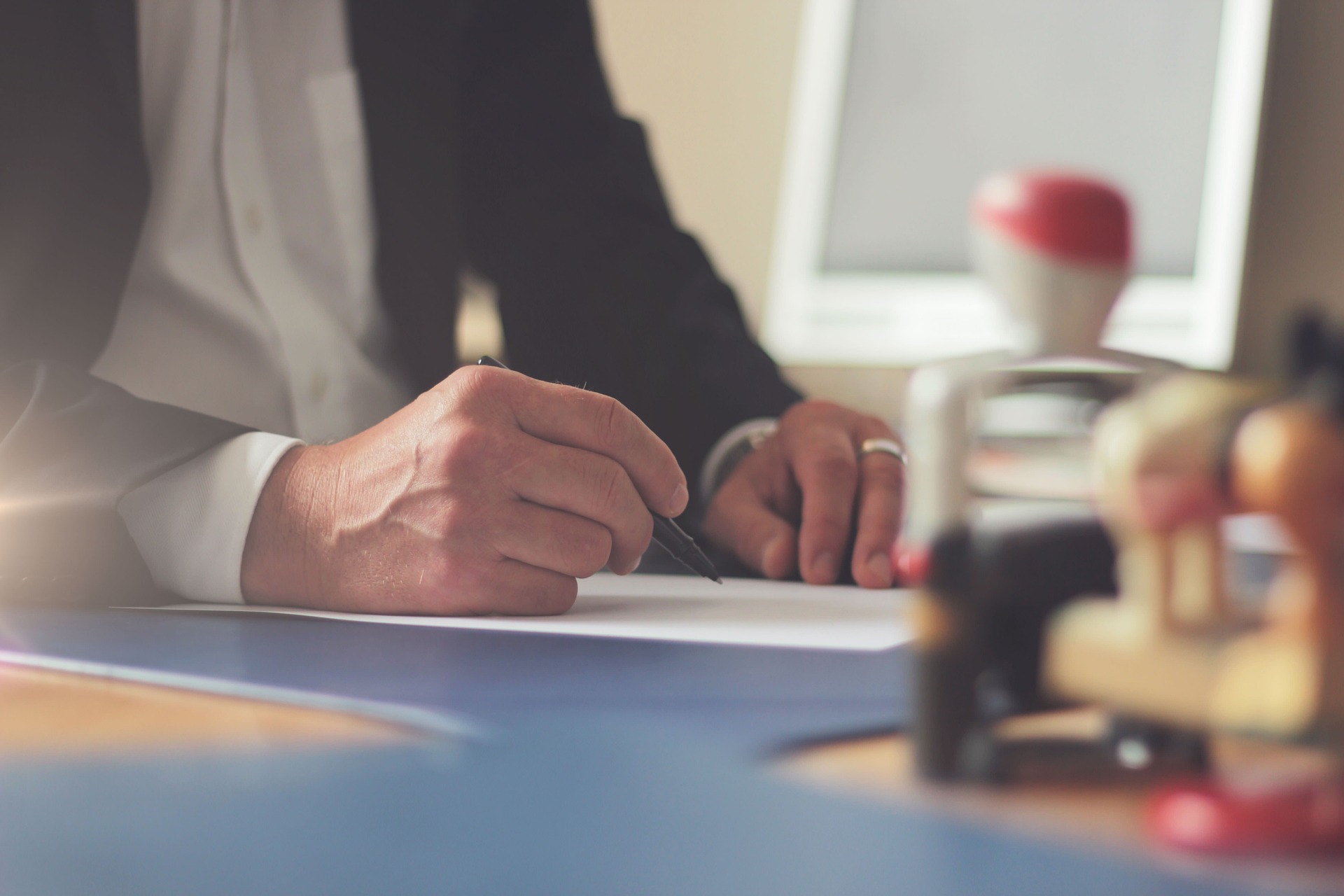 Signing an employment contract at a desk