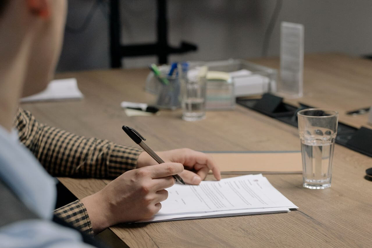 Employee reviewing a settlement agreement document before signing
